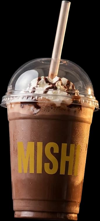 Chocolate Mishi smoothie in a transparent cup with whipped cream and chocolate drizzle