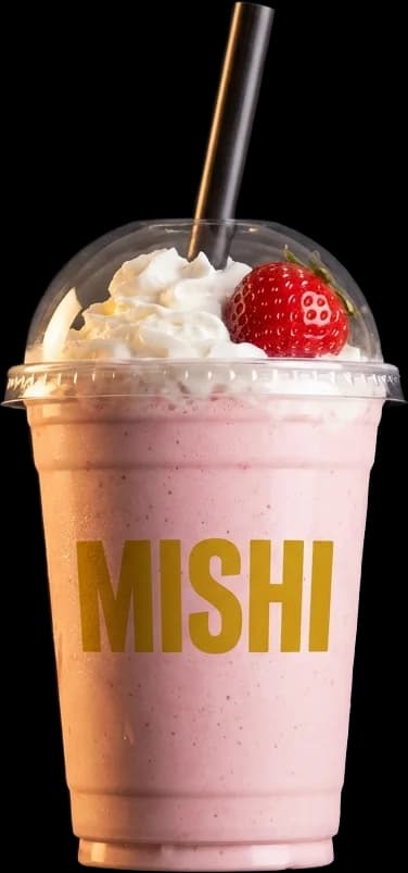 Strawberry Mishi smoothie in a transparent cup topped with a fresh strawberry