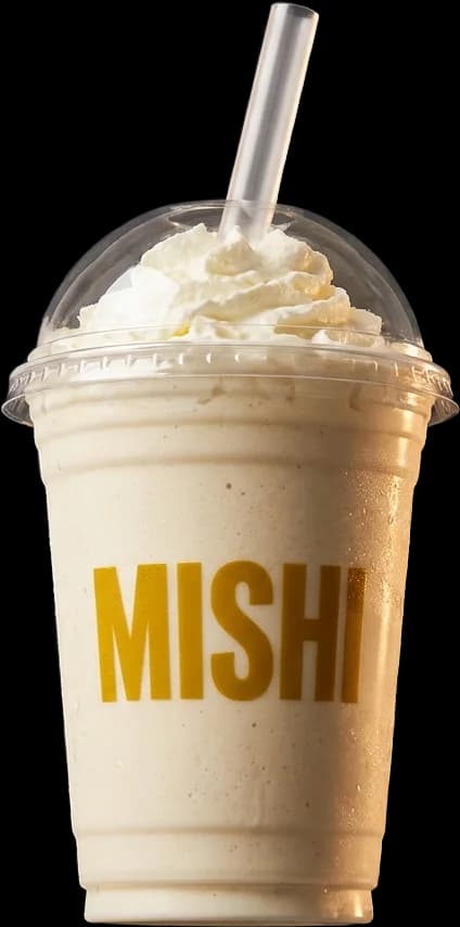 Vanilla Mishi smoothie in a transparent cup with whipped cream and a straw